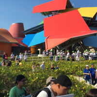 Science supporters walking down the BIOMUSEO' gardens. The BIOMUSEO is in the background. It is a colorful building desgigned by Frank Gehry.